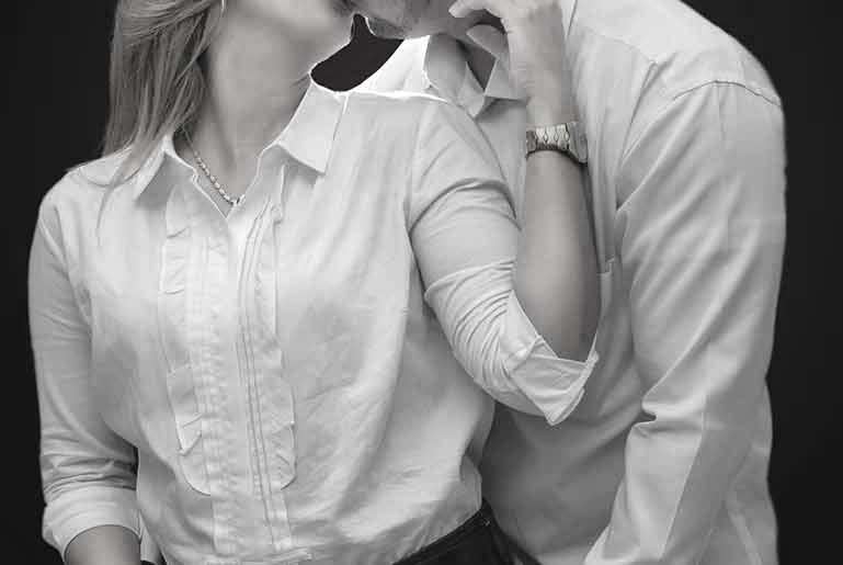 A man hugging a girl from
behind